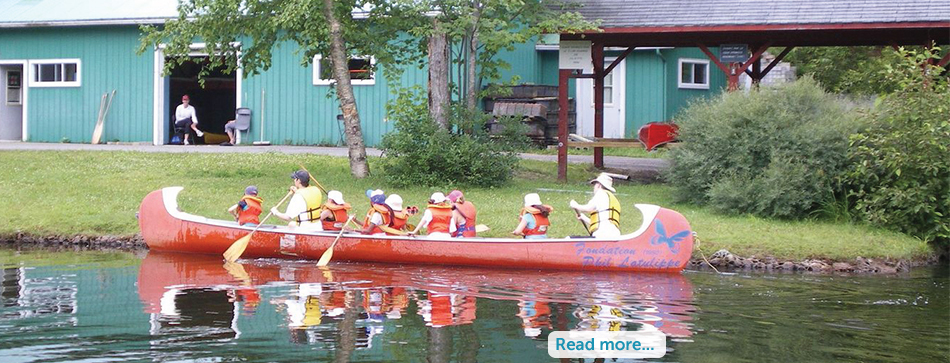Canoeing on the lake at Camp Liberté